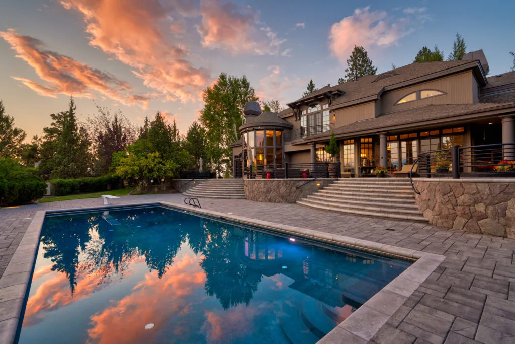 Twilight estate mirrored in a backyard pool, Central Oregon