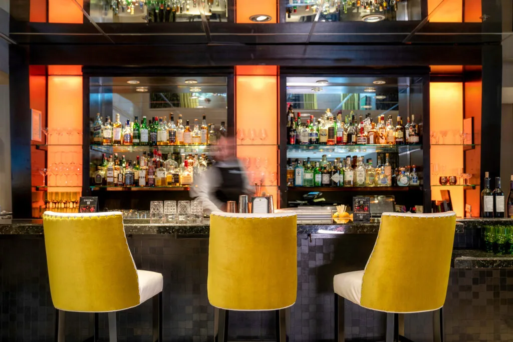 Hotel lounge bar with backlit liquor shelves — hospitality & commercial photography by Wasim Muklashy, Hotel Nikko San Francisco