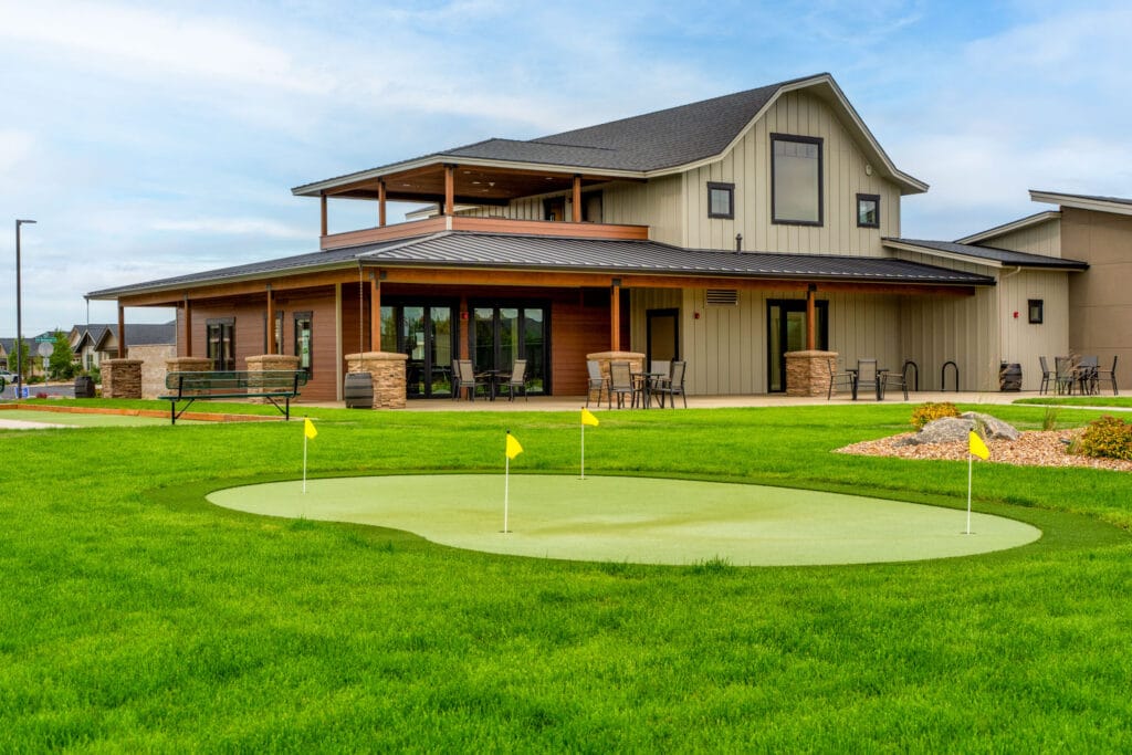 Commercial community center exterior with putting green