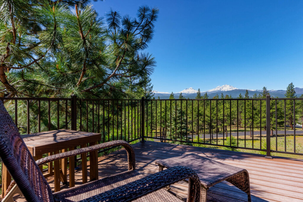 Deck view through ponderosa pines toward the Cascade mountains, Bend Oregon